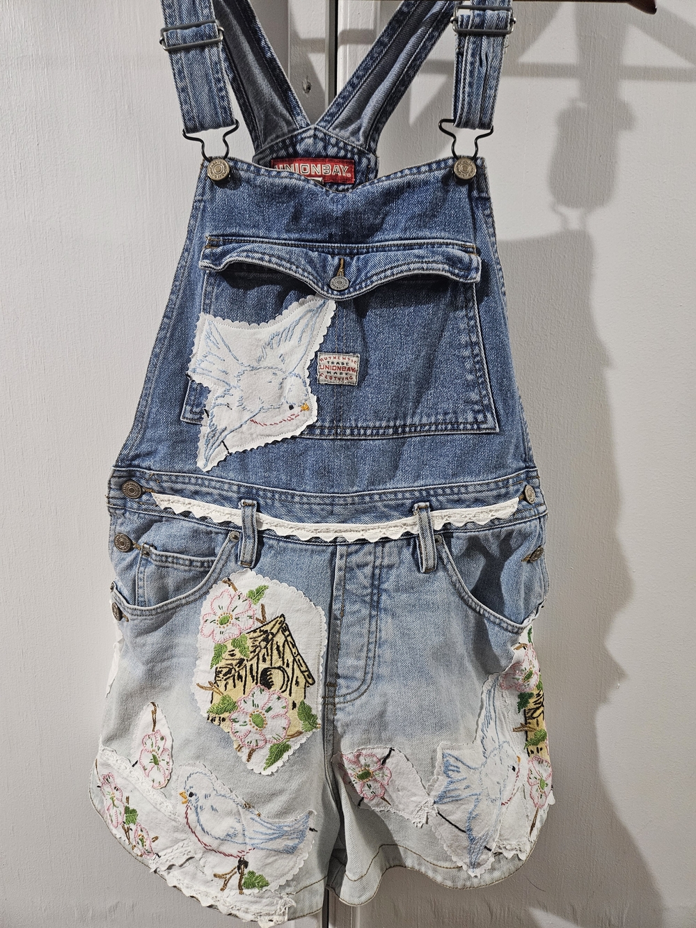 UNIONBAY Distressed Blue Denim Women’s Short Overalls with Embroidered Birds